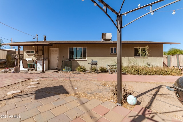 rear view of house with a patio