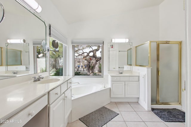 bathroom with independent shower and bath, vanity, and tile patterned floors