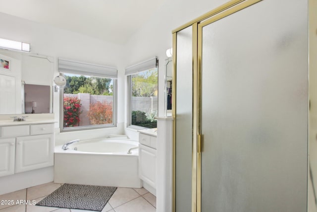 bathroom featuring vanity, tile patterned floors, and plus walk in shower