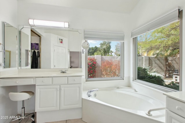 bathroom featuring vanity and a bathtub