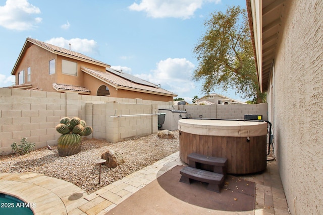 view of patio with a hot tub