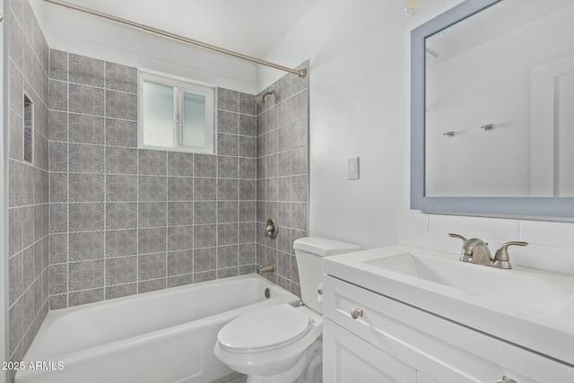 full bathroom with tasteful backsplash, vanity, toilet, and tiled shower / bath