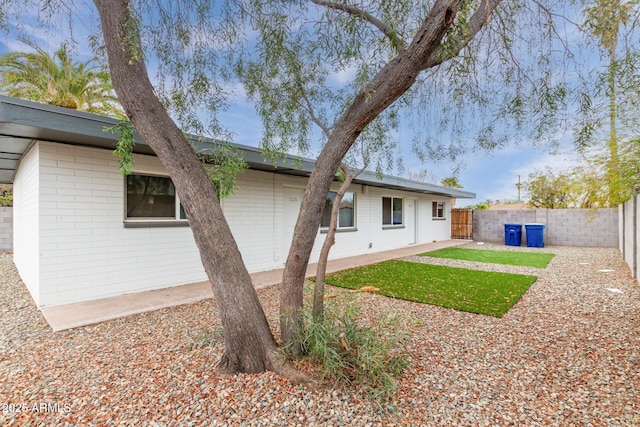 back of house with a patio area