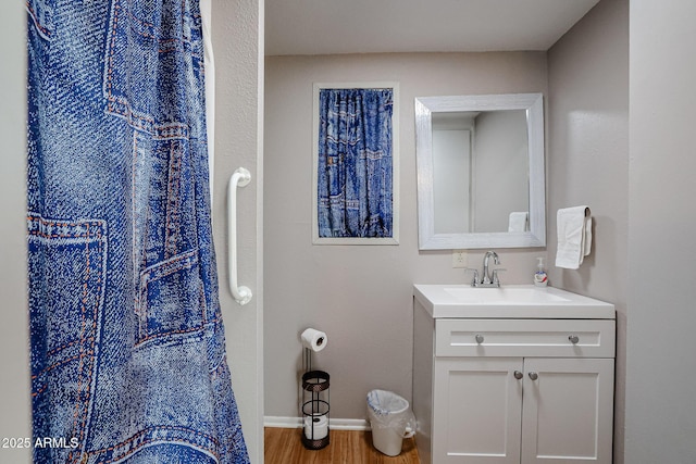 bathroom featuring hardwood / wood-style floors and vanity