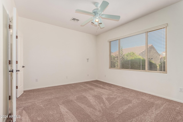 carpeted empty room with ceiling fan