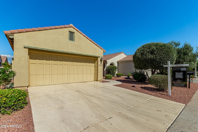 mediterranean / spanish-style house featuring a garage