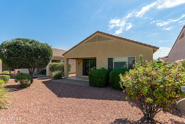 rear view of house with a patio