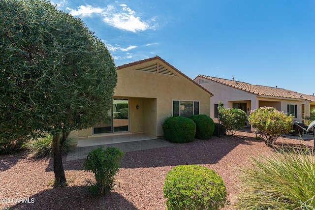 mediterranean / spanish-style home featuring a patio