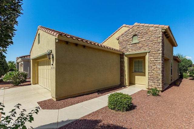 mediterranean / spanish-style home featuring a garage