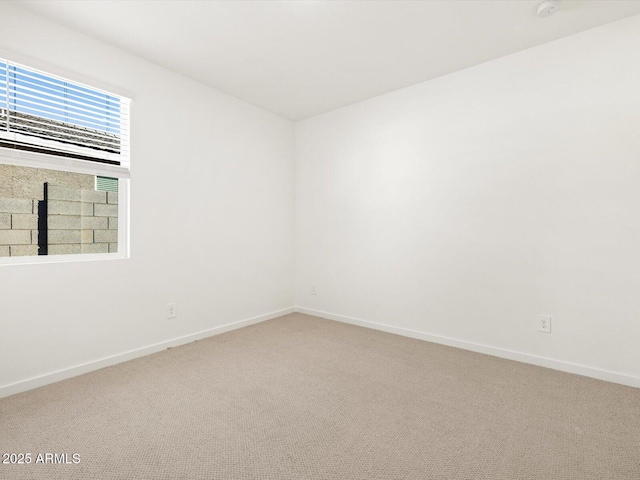 16084 W Prickly Pear Trl, Surprise, AZ 85387 - spare room featuring carpet floors and baseboards
