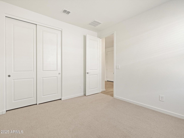 16084 W Prickly Pear Trl, Surprise, AZ 85387 - unfurnished bedroom with visible vents, baseboards, and light colored carpet