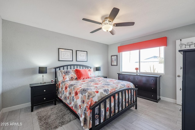 bedroom featuring ceiling fan and light hardwood / wood-style flooring