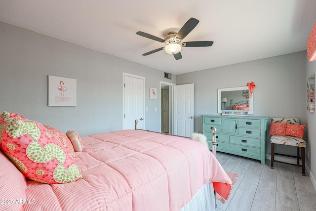 bedroom featuring ceiling fan and light hardwood / wood-style flooring