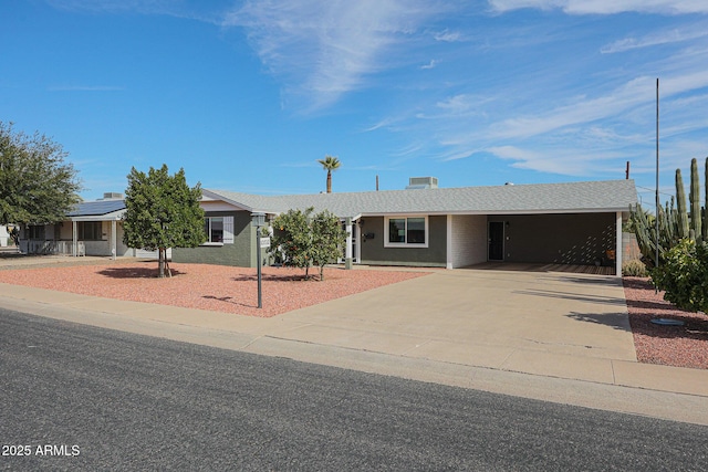 single story home featuring a carport