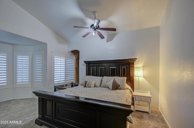 bedroom featuring light carpet, ceiling fan, and lofted ceiling