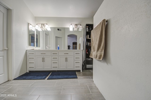 bathroom with vanity and tile patterned flooring