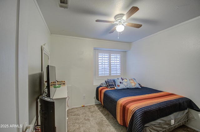 carpeted bedroom with ceiling fan and crown molding