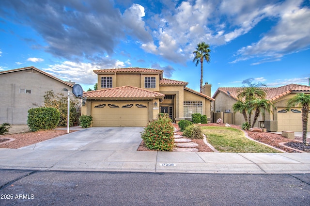 mediterranean / spanish house featuring a garage