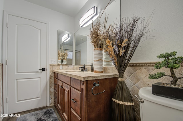 bathroom with toilet and vanity