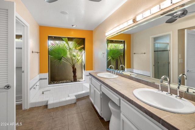 bathroom featuring vanity, independent shower and bath, and tile patterned flooring