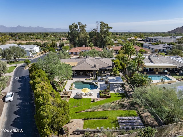 birds eye view of property with a mountain view