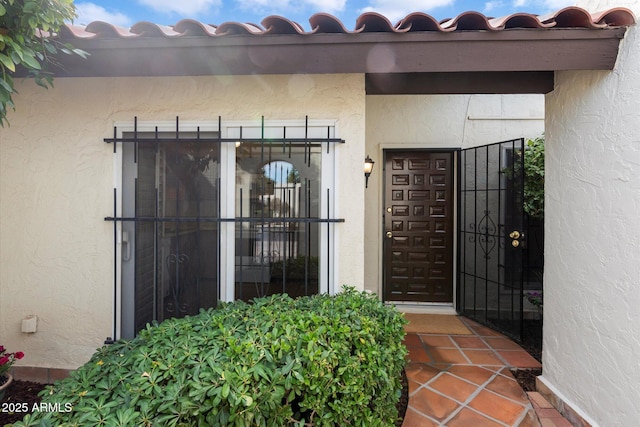 doorway to property with stucco siding