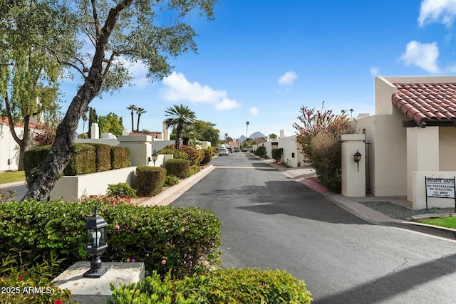 view of street featuring a residential view and street lights