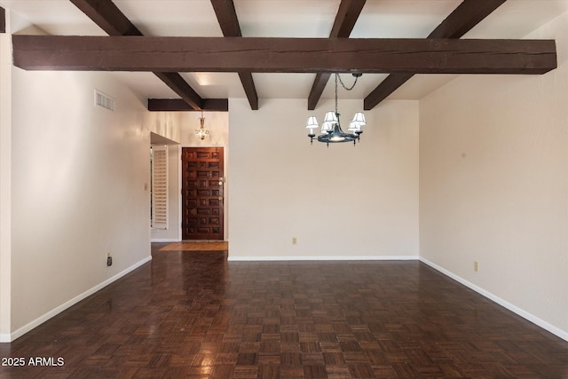 empty room with beamed ceiling, dark parquet flooring, and a chandelier