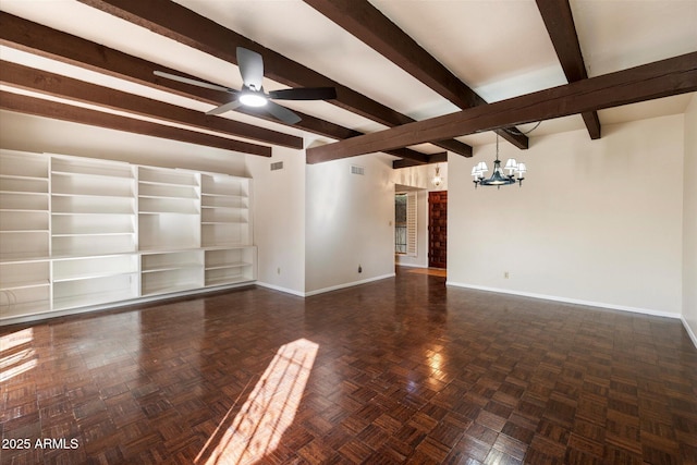 spare room featuring ceiling fan with notable chandelier, visible vents, beam ceiling, and baseboards