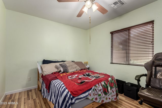 40264 W Lococo St, Maricopa, AZ 85138 - bedroom with visible vents, a ceiling fan, baseboards, and wood finished floors