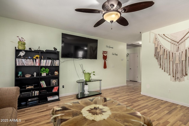 40264 W Lococo St, Maricopa, AZ 85138 - living area with baseboards, a ceiling fan, and wood finished floors