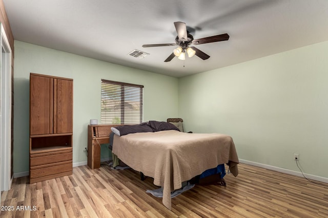 40264 W Lococo St, Maricopa, AZ 85138 - bedroom featuring visible vents, a ceiling fan, light wood finished floors, and baseboards