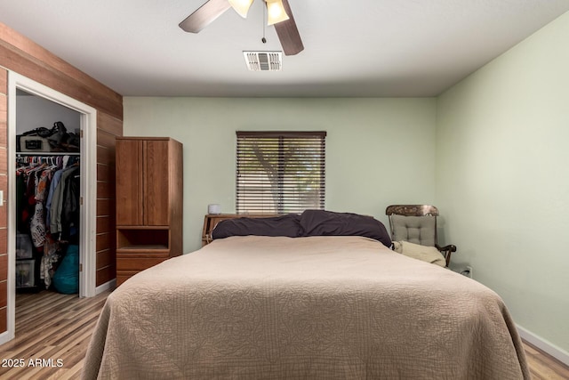 40264 W Lococo St, Maricopa, AZ 85138 - bedroom featuring visible vents, wood finished floors, a spacious closet, and a closet