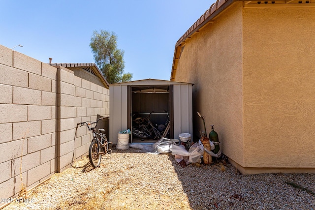 40264 W Lococo St, Maricopa, AZ 85138 - exterior space featuring an outbuilding, fence, and a storage shed
