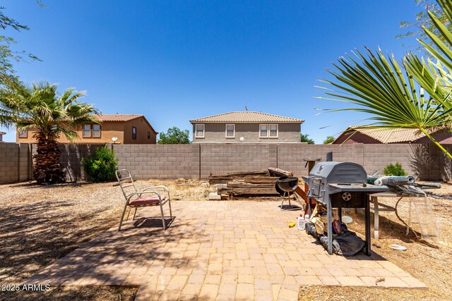 40264 W Lococo St, Maricopa, AZ 85138 - view of patio / terrace featuring a fenced backyard and grilling area