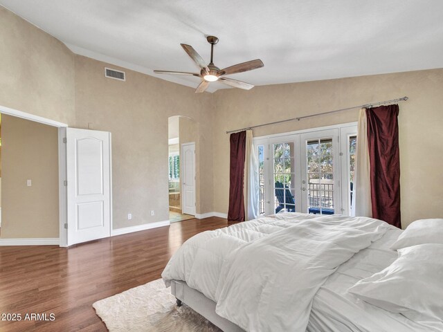 19506 N 73rd Ave, Glendale, AZ 85308 - bedroom featuring french doors, arched walkways, access to outside, multiple windows, and high vaulted ceiling