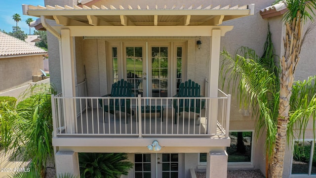 19506 N 73rd Ave, Glendale, AZ 85308 - entrance to property with french doors, a balcony, and stucco siding