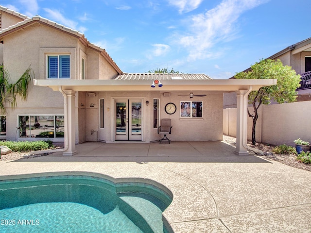 19506 N 73rd Ave, Glendale, AZ 85308 - back of house with french doors, a patio, an outdoor pool, stucco siding, and a tiled roof