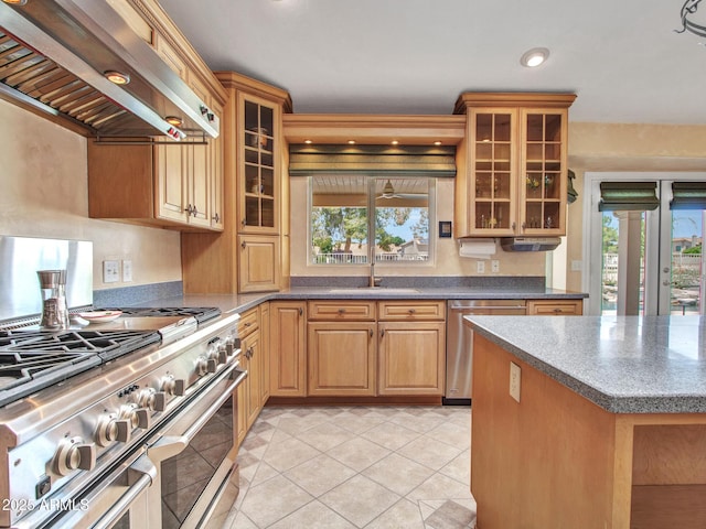 19506 N 73rd Ave, Glendale, AZ 85308 - kitchen featuring stainless steel appliances, wall chimney range hood, light tile patterned floors, glass insert cabinets, and recessed lighting