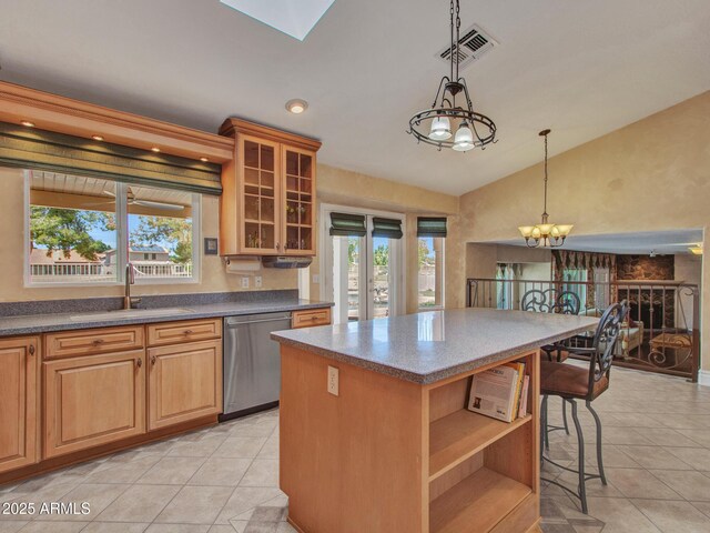 19506 N 73rd Ave, Glendale, AZ 85308 - kitchen featuring stainless steel dishwasher, a sink, vaulted ceiling, light tile patterned flooring, and a chandelier