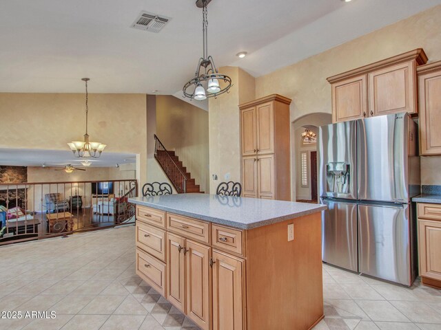 19506 N 73rd Ave, Glendale, AZ 85308 - kitchen featuring stainless steel refrigerator with ice dispenser, a chandelier, vaulted ceiling, light tile patterned floors, and a ceiling fan
