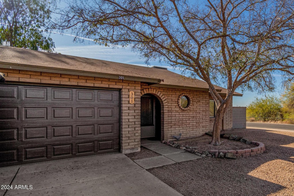 single story home featuring a garage