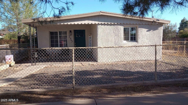 735 E 3rd St, Douglas, AZ 85608 - view of front of property featuring a fenced front yard and stucco siding