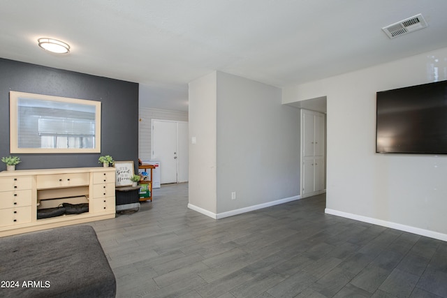 unfurnished living room with hardwood / wood-style flooring