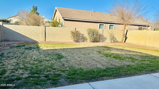 view of yard with a fenced backyard