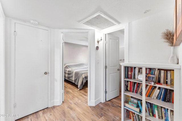 3508 E Gelding Dr, Phoenix, AZ 85032 - hallway with light wood-style flooring and baseboards