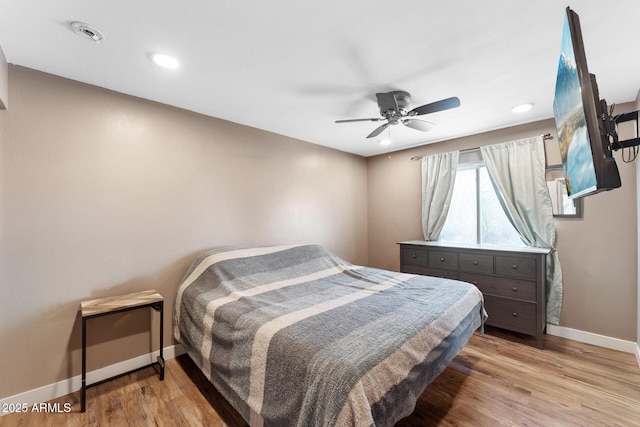 3508 E Gelding Dr, Phoenix, AZ 85032 - bedroom featuring baseboards, light wood-style floors, recessed lighting, and ceiling fan
