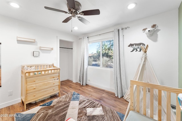 3508 E Gelding Dr, Phoenix, AZ 85032 - bedroom featuring baseboards, recessed lighting, wood finished floors, a closet, and ceiling fan