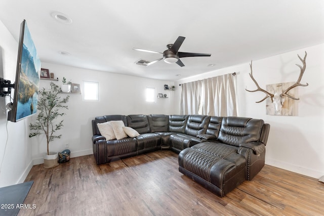 3508 E Gelding Dr, Phoenix, AZ 85032 - living room featuring ceiling fan, wood finished floors, and baseboards