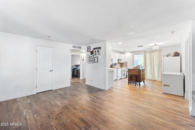 3508 E Gelding Dr, Phoenix, AZ 85032 - living room with light wood-style flooring, baseboards, and recessed lighting